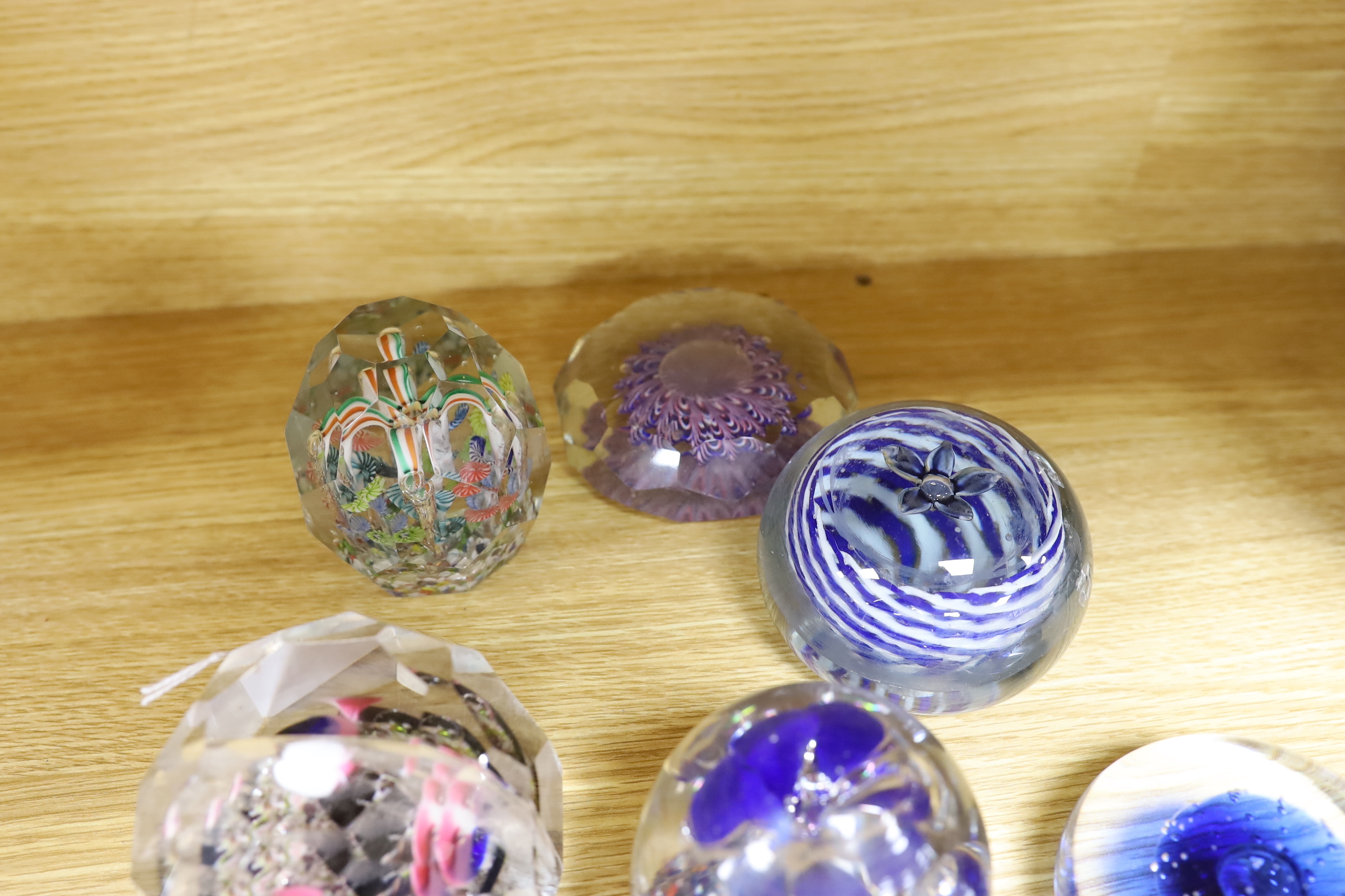 Nine various Bohemian or Hungarian glass paperweights, including for early 20th century Bohemian faceted glass paperweights